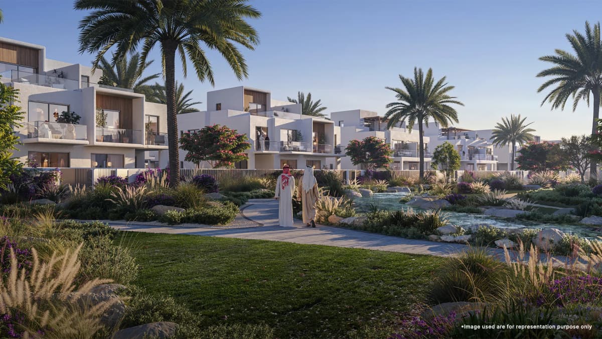 Two Mens are at Serene grass path at Emaar Rivana, The Valley, surrounded by greenery and scenic landscapes