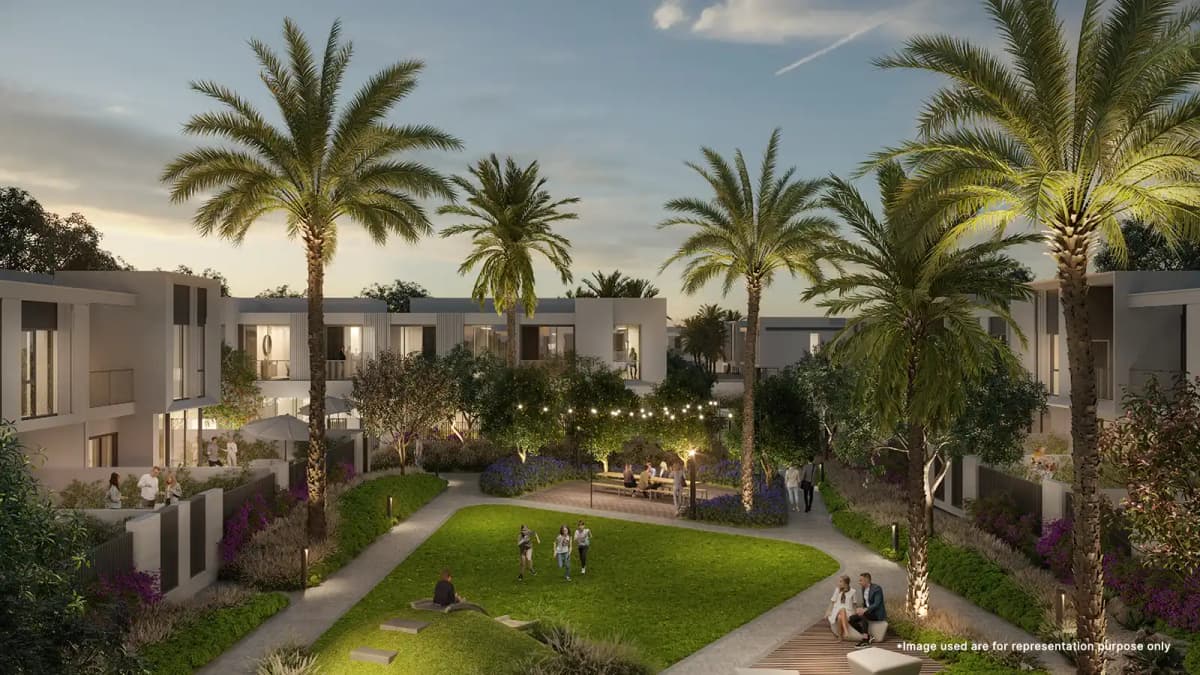 Children joyfully playing in the vibrant common garden zone at Emaar Talia The Valley, surrounded by greenery.